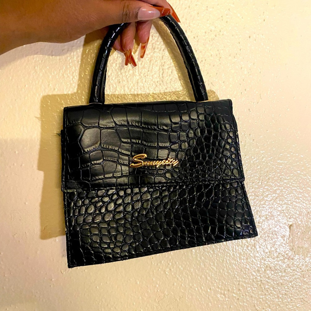 A square little sexy black bag.